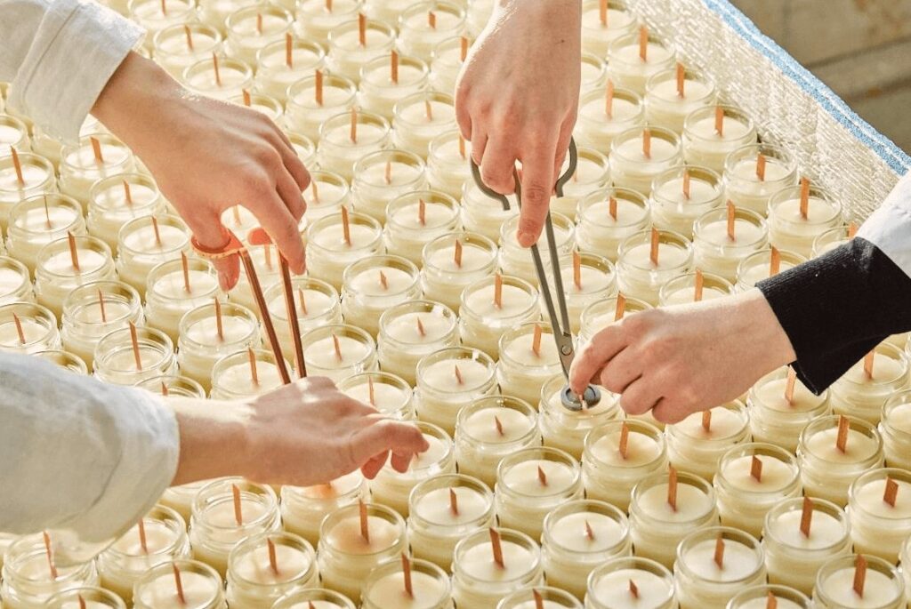 candle wick installation during candle production